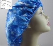 The Mercer is the "on the go/no frills" variation of the Whidbey. It allows the hair to be tucked under the cap and has no ties to worry about.  The elastic is designed to keep your hair controlled,  yet not be too tight or uncomfortable.  The Mercer might remind you of a "shower cap" design in its simplicity.